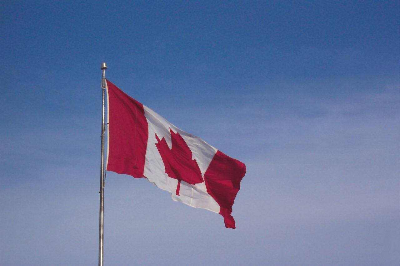 Canadian Flag Waving In The Wind