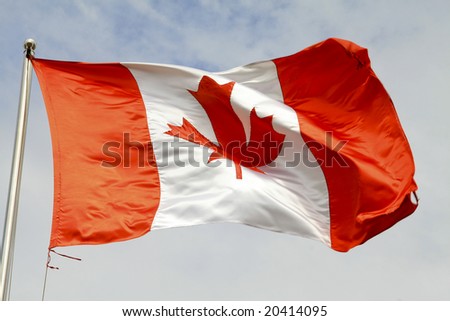 Canadian Flag Waving In The Wind