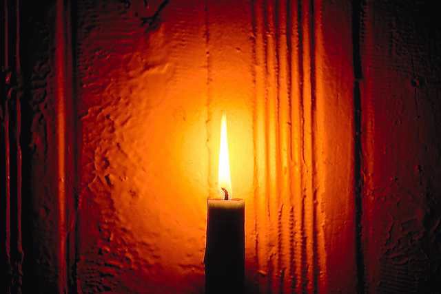 Candles Burning In Dark