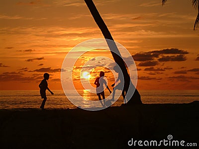 Children Playing Football On The Beach