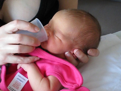 Feeding Baby Milk From A Cup