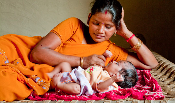 Indian Mother Feeding Baby