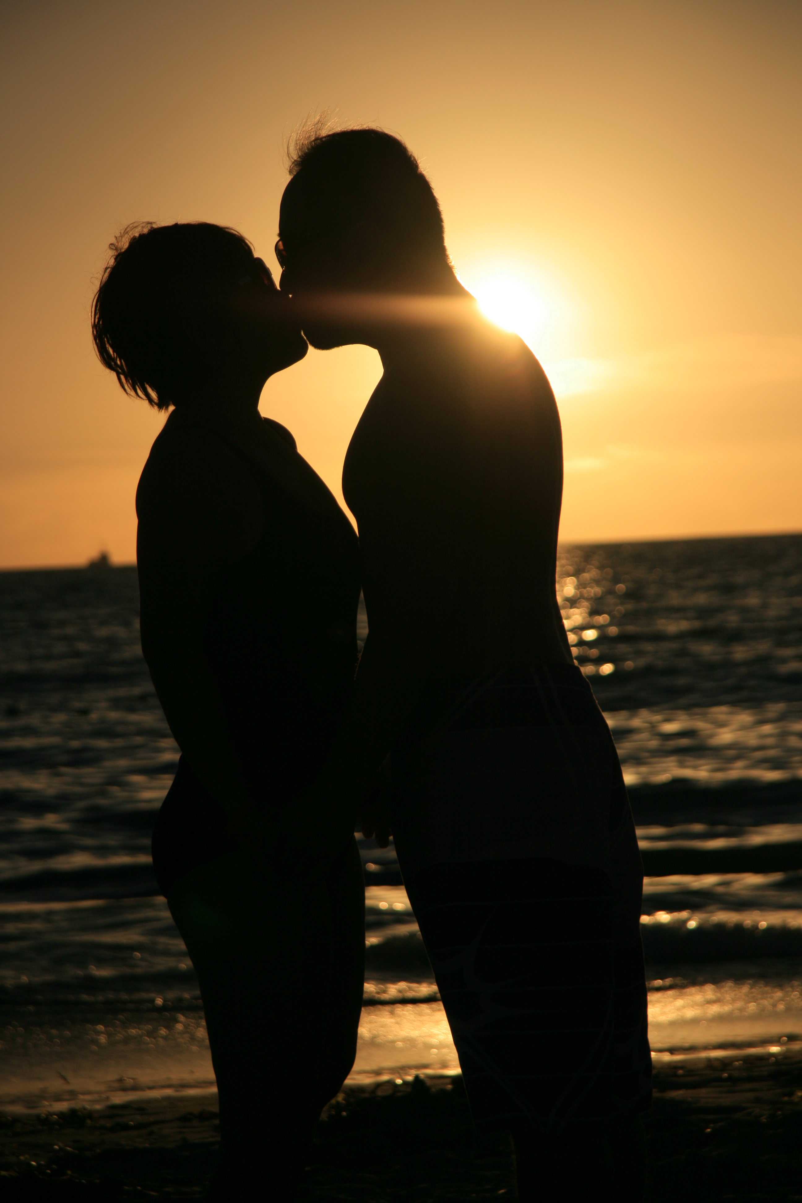 People Kissing On The Beach